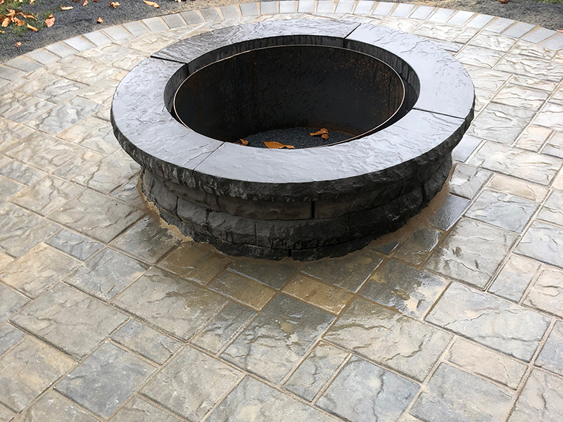 Stone firepit on stone patio