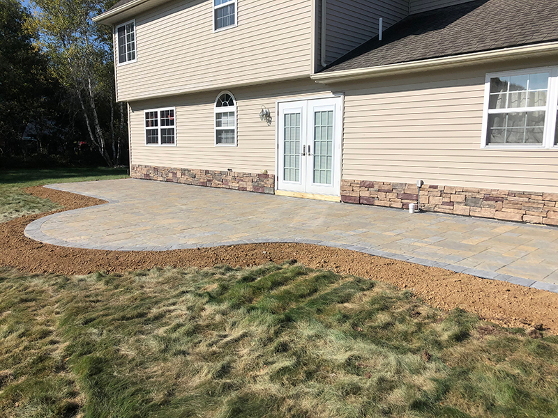 Stone backyard patio and sidewalk